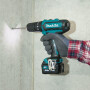 Аккумуляторная ударная дрель-шуруповерт MAKITA HP 331 DWAE в чем.
